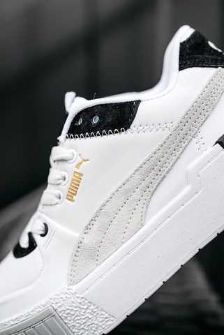 puma cali sport hi-top sneakers in white and black